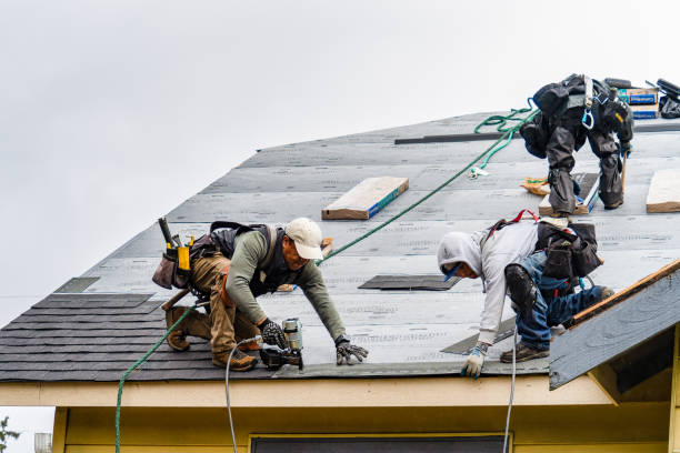 Professional Roofing technician working in Patchogue, NY
